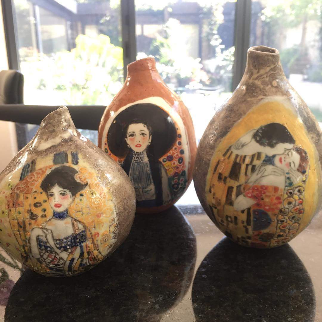 A trio of hand-built bud vases with Klimt-inspired painting styles, by Mary Funk